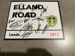 LEEDS UNITED SIGNED 2026 METAL STREET SIGN  FOOTBALL PROOF SHIRT BALL PHOTO 1 for sale on Ebay