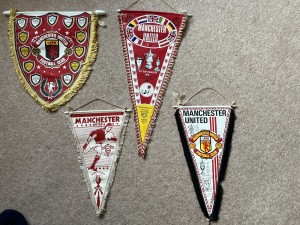 Four vintage Manchester United football pennants from the 70s for sale on Ebay